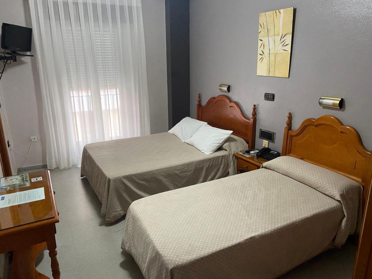 Quarto Triplo com Casa de Banho Privativa