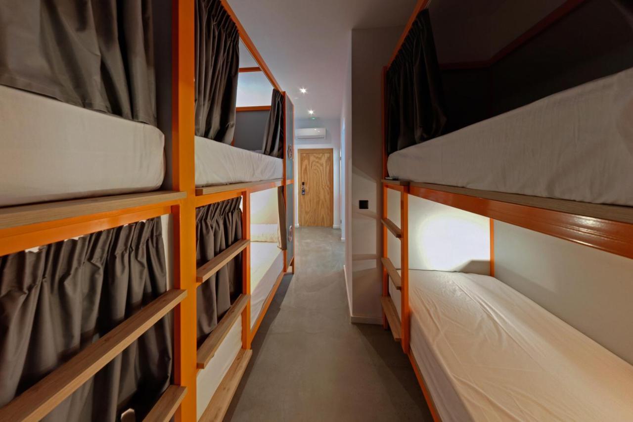 Cama en habitación compartida de 6 camas
