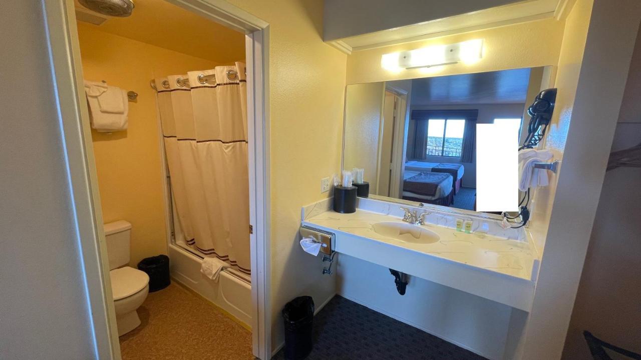 2 Queen Beds with AC, Microwave, and Fridge