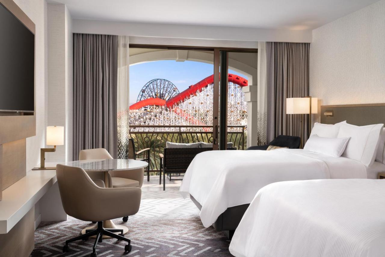 Queen Room with Balcony and Theme Park View - Mobility Accessible with Roll-in Shower