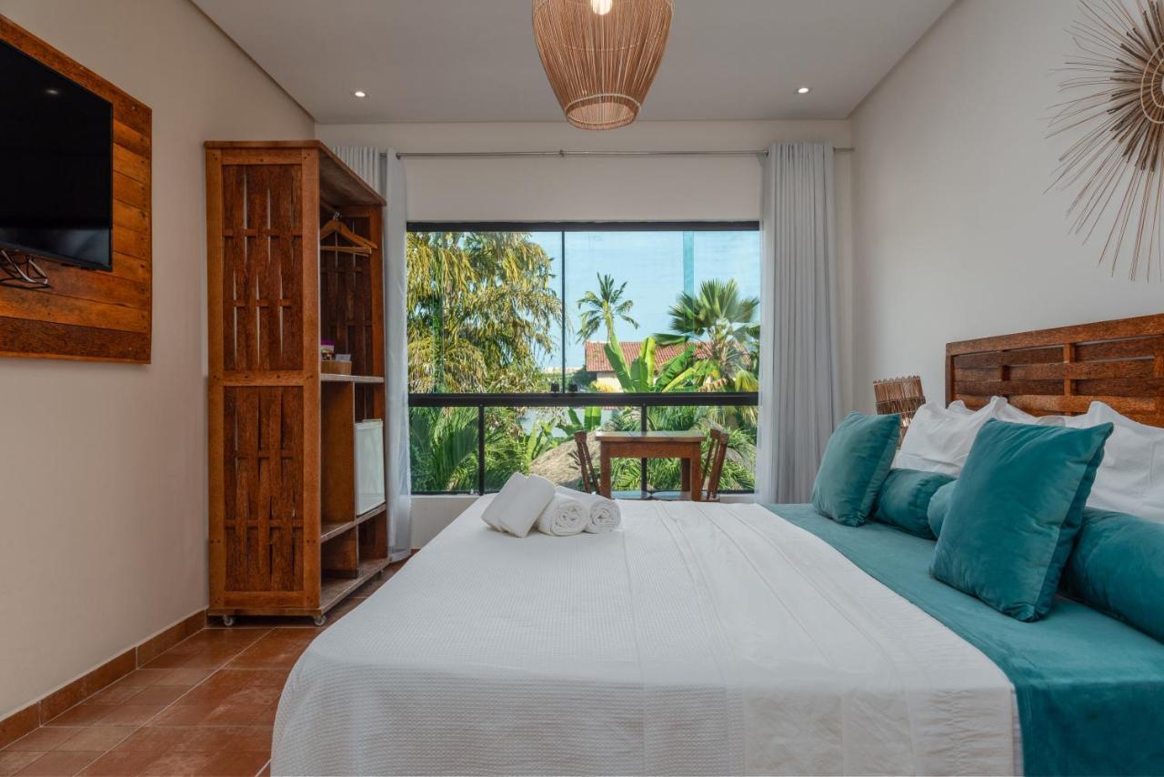 Suíte Tripla com vista para o jardim