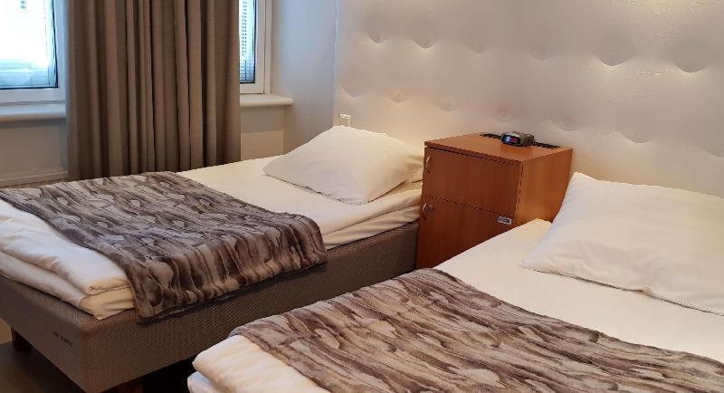 Tweepersoonskamer met 2 Aparte Bedden