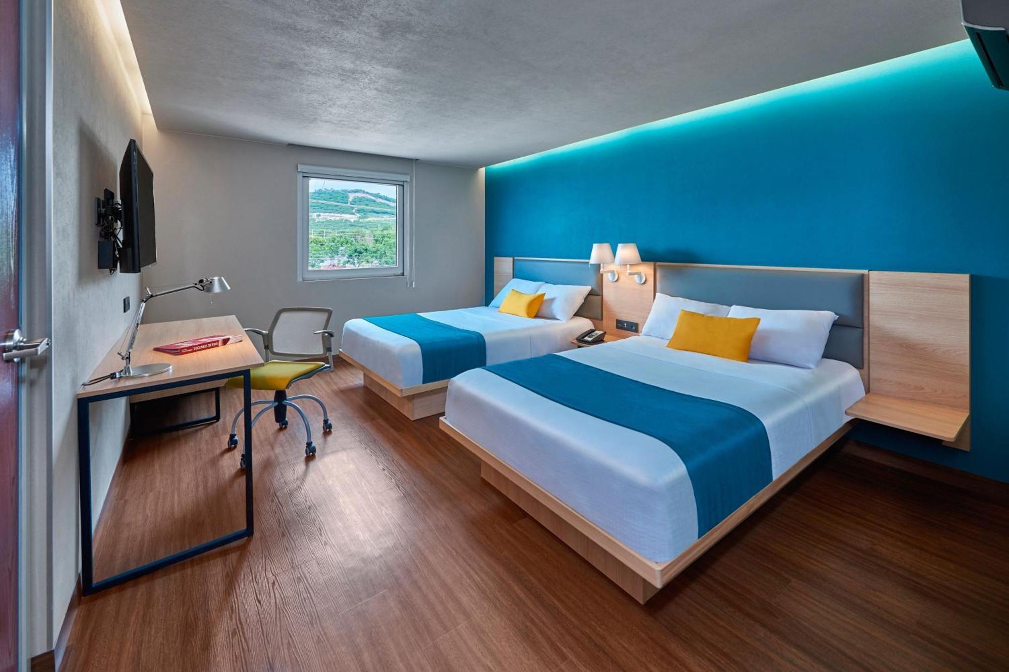 Suite voor 2 Personen met 2 Tweepersoonsbedden en Slaapbank