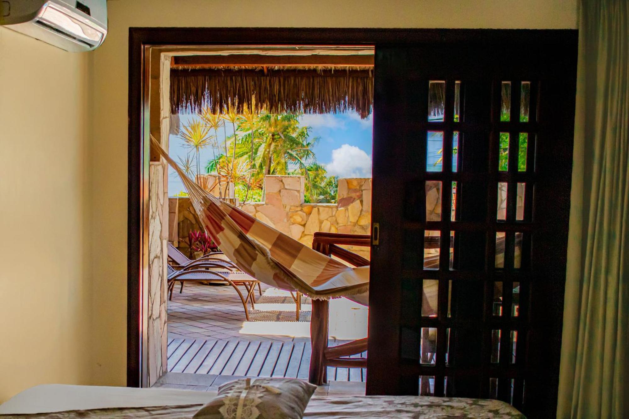 Quarto Quádruplo com Vista do Mar.