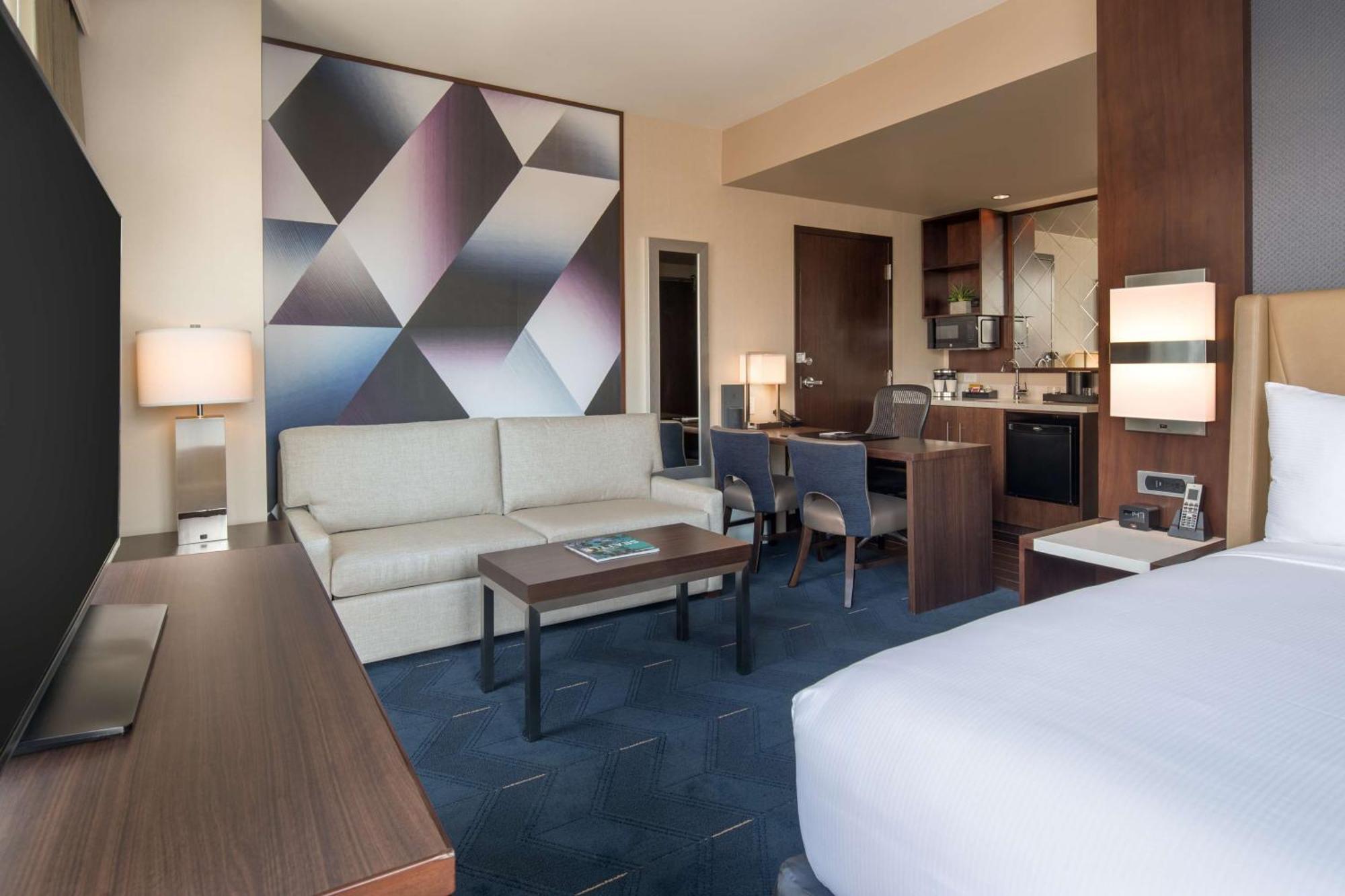 Corner Studio Suite with One King Bed, Sofa Bed and Stadium View