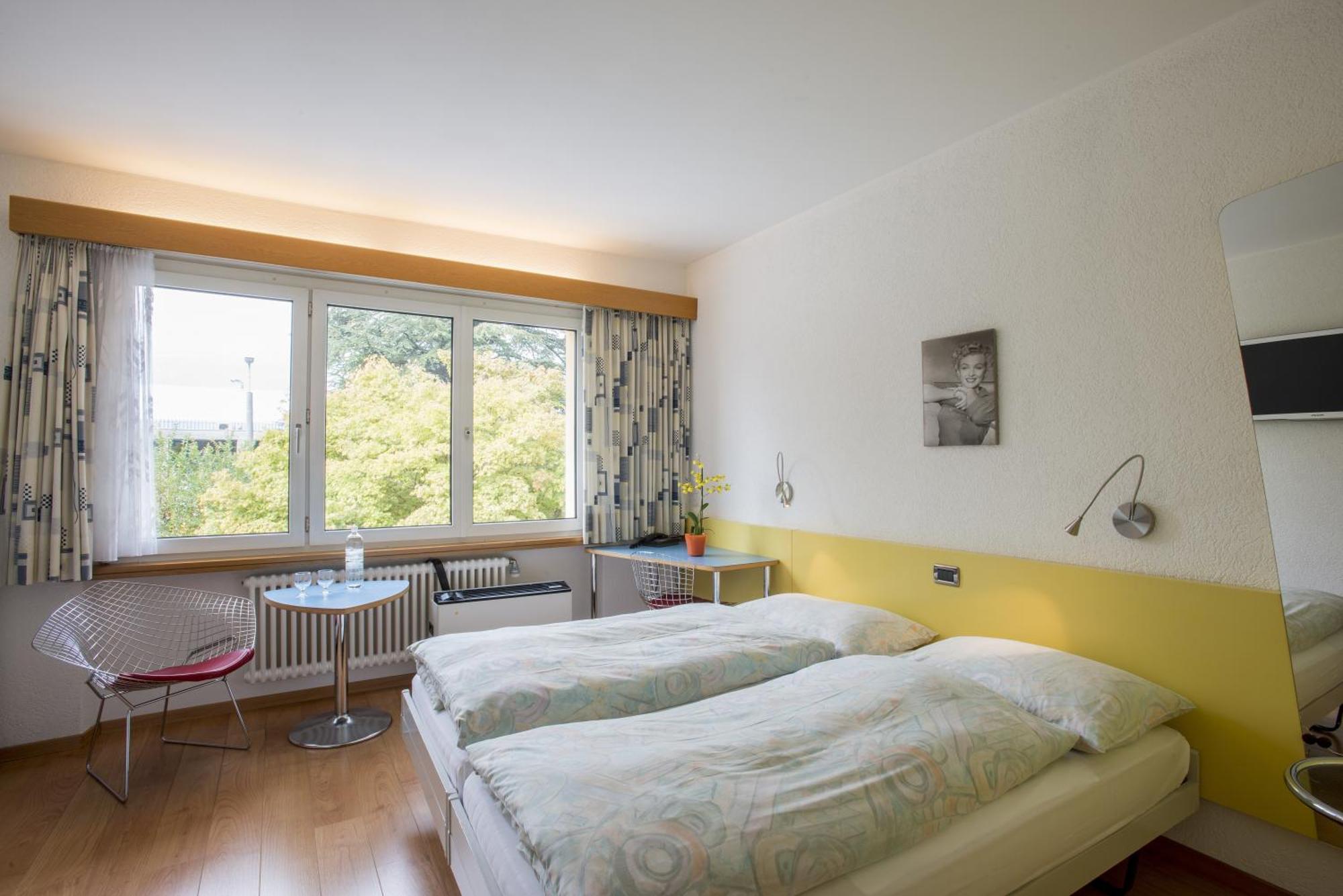 Tweepersoonskamer met 2 Aparte Bedden
