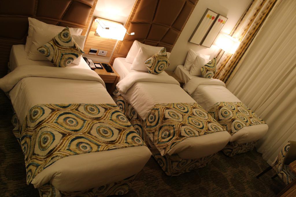 Chambre Deluxe avec 3 Lits Simples