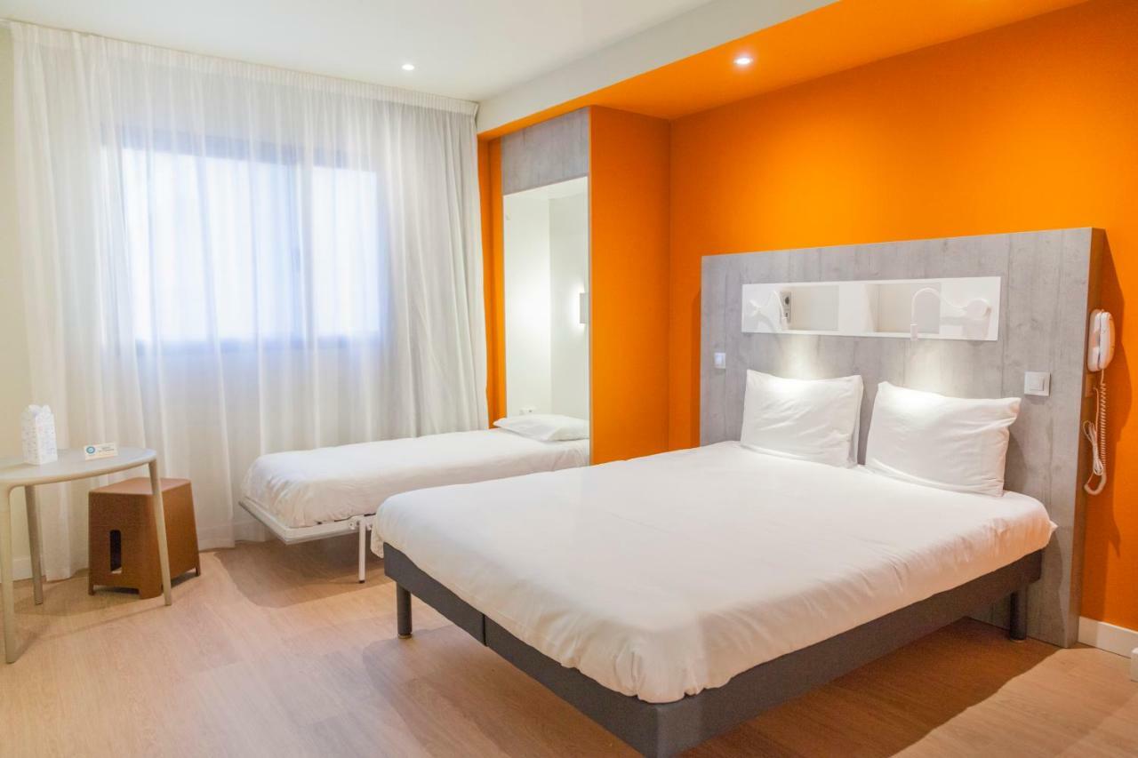 Habitación Triple con una cama doble y una individual